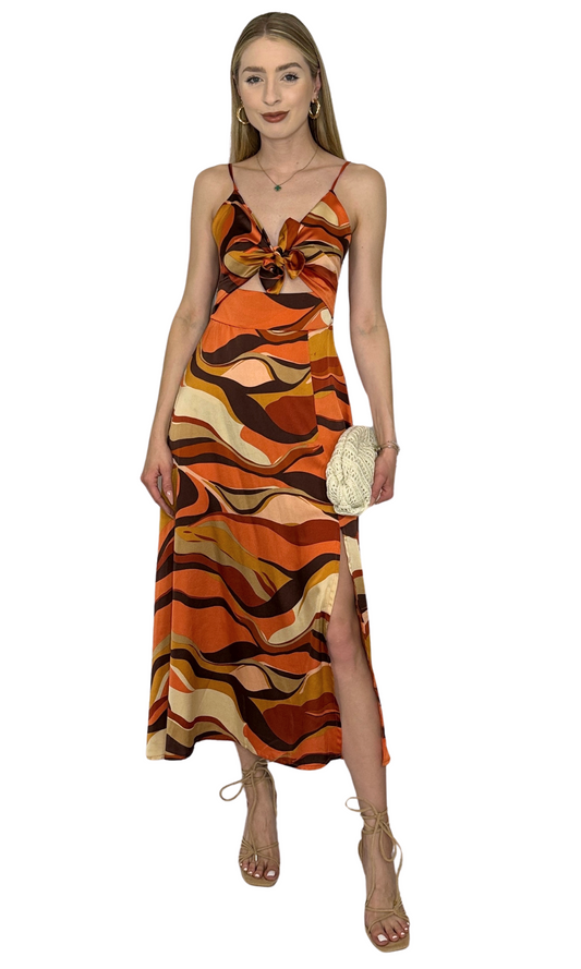 Fitted dress with adjustable straps, back zipper, and bow-tie detail designed for a flattering and feminine silhouette