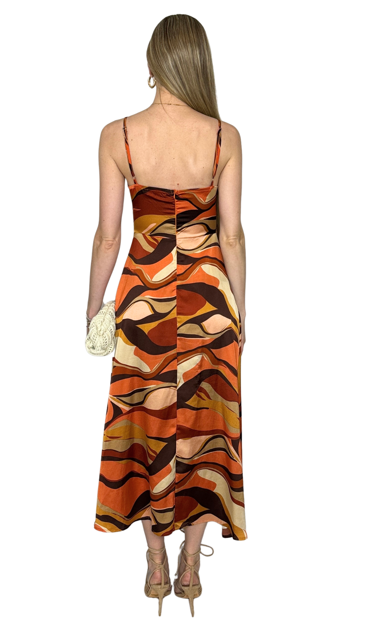Fitted dress with adjustable straps, back zipper, and bow-tie detail designed for a flattering and feminine silhouette