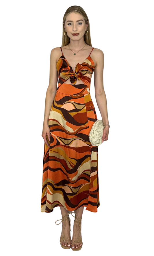 Fitted dress with adjustable straps, back zipper, and bow-tie detail designed for a flattering and feminine silhouette