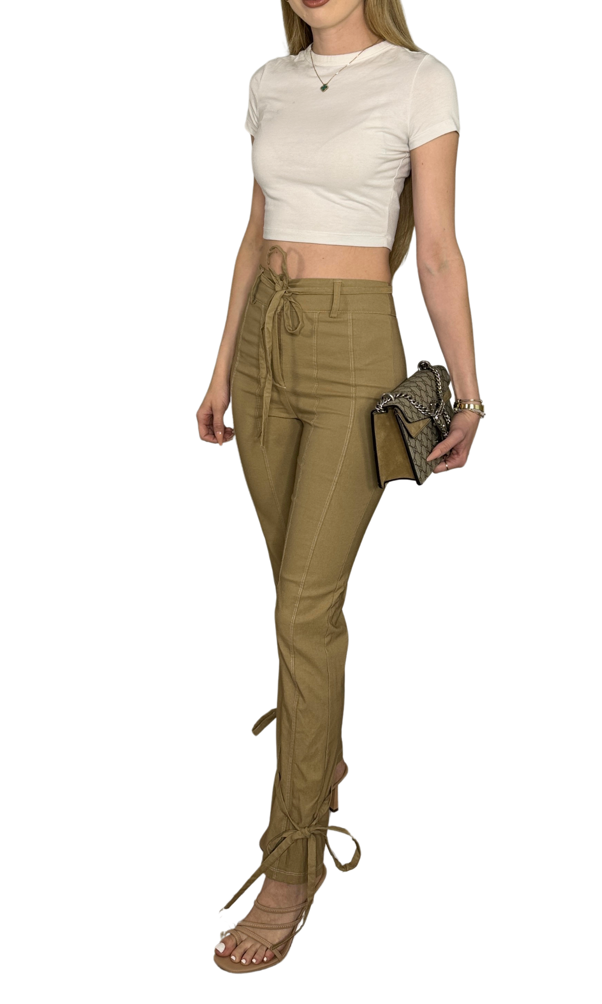 Khaki high-waisted tie pants with a removable belt, white contrast stitching, and tie accents at the ankles.