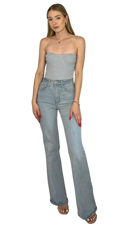 Baby blue ribbed knit strapless bodysuit with thong snap closure, made from soft and breathable fabric for all-day comfort.