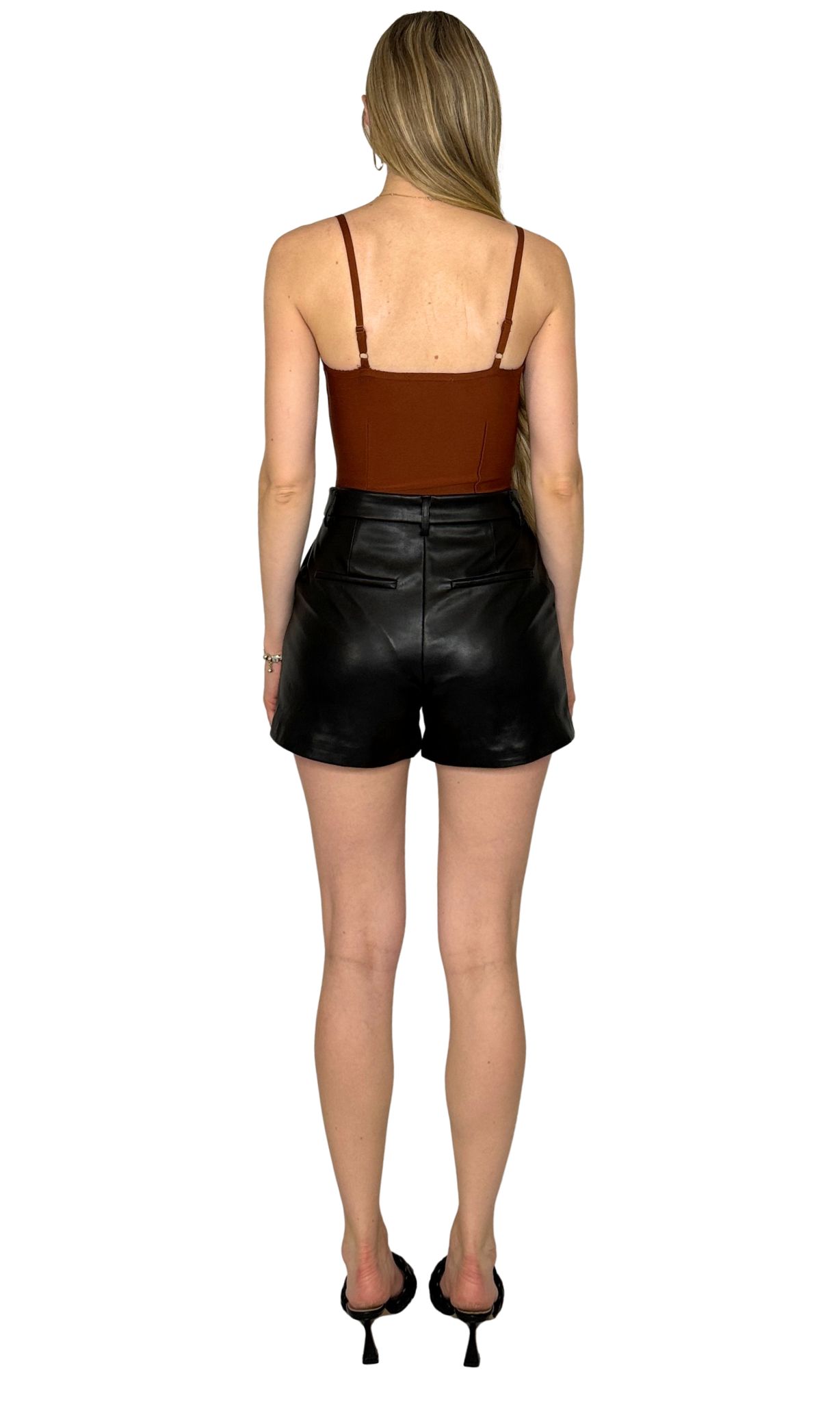 Bandage style bodysuit with thick supportive fabric, adjustable straps, non-padded cups, and snap thong closure for a secure fit.