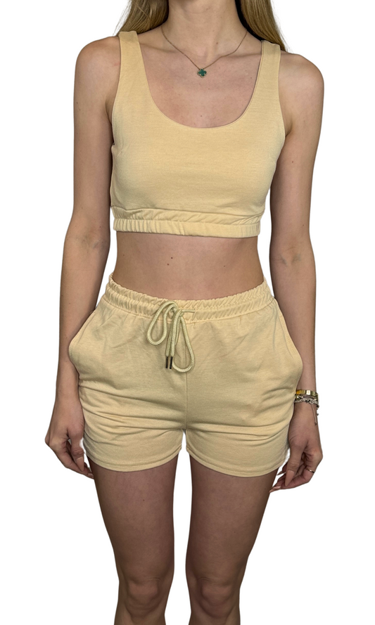 Women's beige knit lounge set with cropped tank top and high-waisted drawstring shorts – soft lightweight fabric ideal for comfort and casual wear