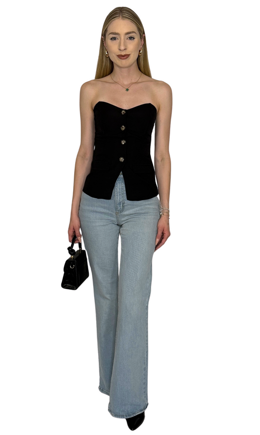 Black bustier top featuring a button-down front, faux flap pockets, sweetheart neckline, and an adjustable elastic back for a flattering and comfortable fit — the Celine Bustier Top.
