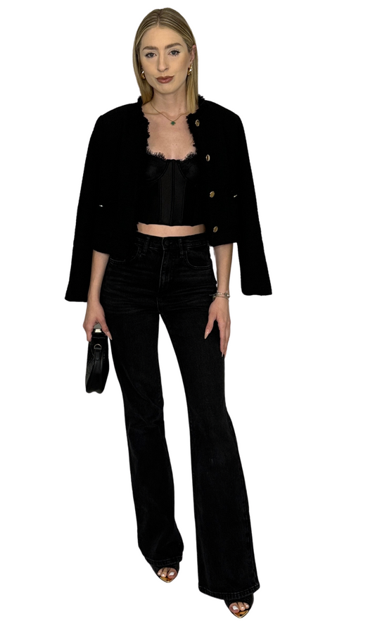 Black corset top featuring structured boning, concealed underwire, adjustable straps, and a hook and eye closure with three rows along the back for a secure and customizable fit — the Alara Corset Top.