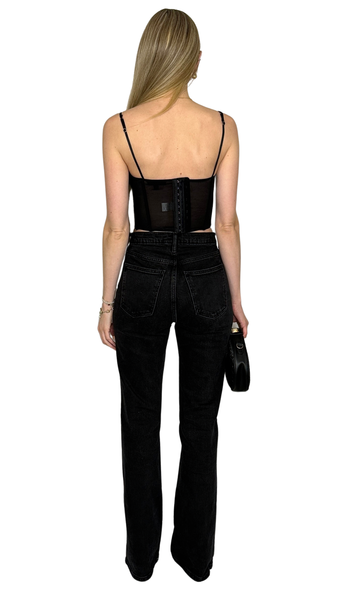 Black corset top featuring structured boning, concealed underwire, adjustable straps, and a hook and eye closure with three rows along the back for a secure and customizable fit — the Alara Corset Top.