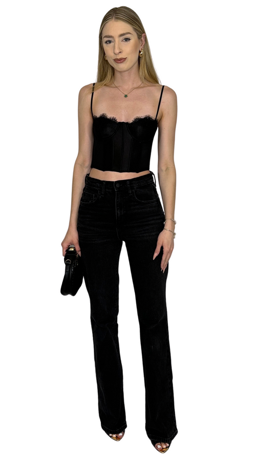 Black corset top featuring structured boning, concealed underwire, adjustable straps, and a hook and eye closure with three rows along the back for a secure and customizable fit — the Alara Corset Top.