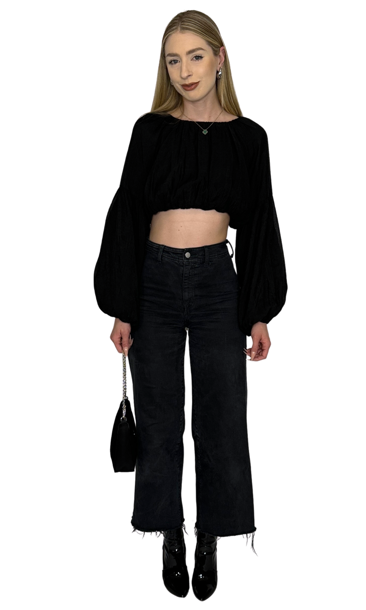 Black crop top featuring long puff sleeves with elastic at the bottom for a balloon effect, made from soft, comfortable fabric ideal for day-to-day wear with stylish sleeve shaping.