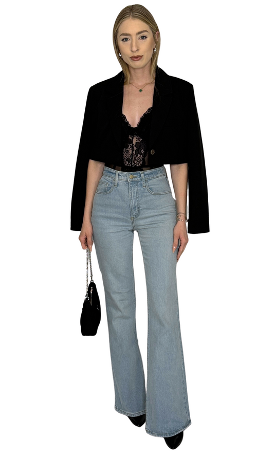 Black mesh bodysuit featuring intricate lace details, wire cups, thong cut with snap closure, and adjustable straps for a comfortable fit and elegant style — the Iris Lace Bodysuit.