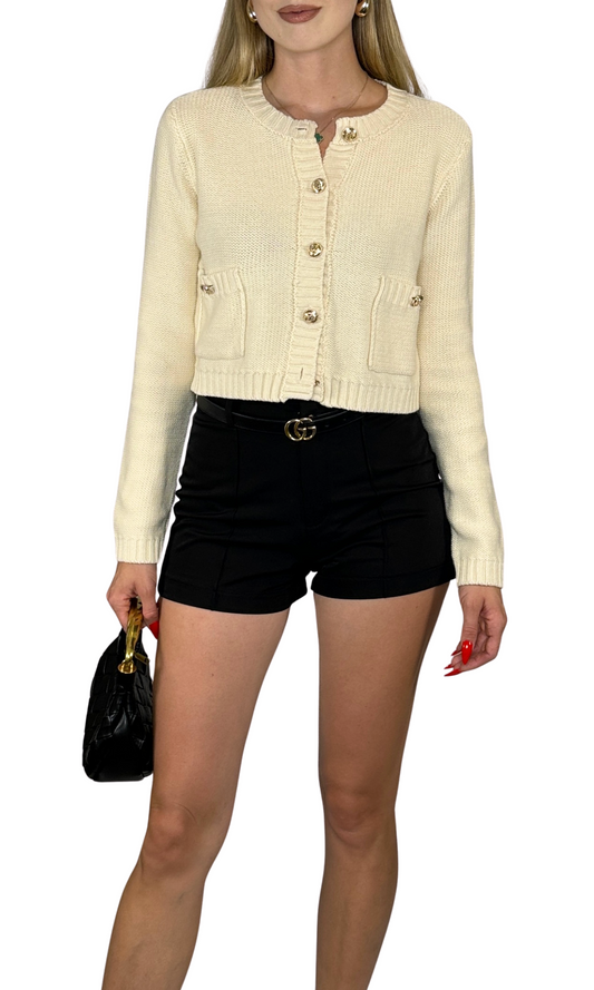Cropped cardigan with round neckline, long sleeves, ribbed trim, and gold button details