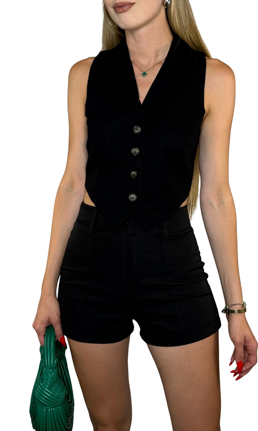 Black linen vest with collared V-neckline, button front, and back tie detail