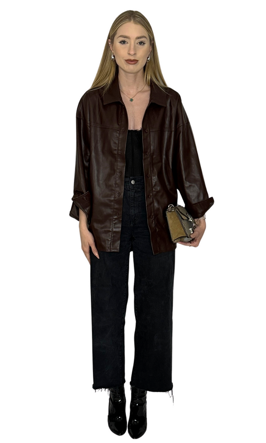 Dark brown faux leather button-down shirt with a longer back rounded hem, soft leather-like feel, and versatile styling options.