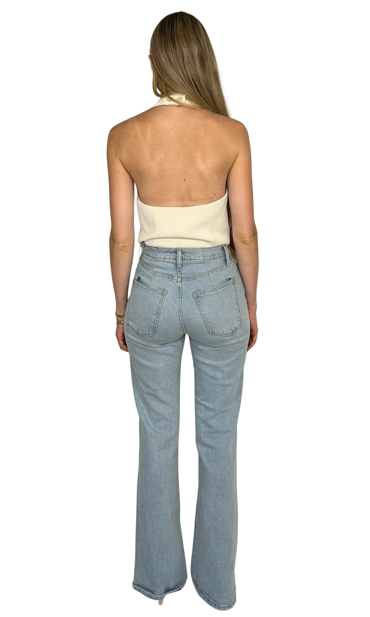 Ellis cream halter vest featuring a deep V-neckline, button-up front, adjustable halter strap, and cropped cut for a flirty, modern twist on tailored style.