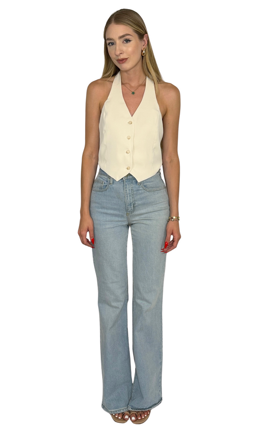 Ellis cream halter vest featuring a deep V-neckline, button-up front, adjustable halter strap, and cropped cut for a flirty, modern twist on tailored style.