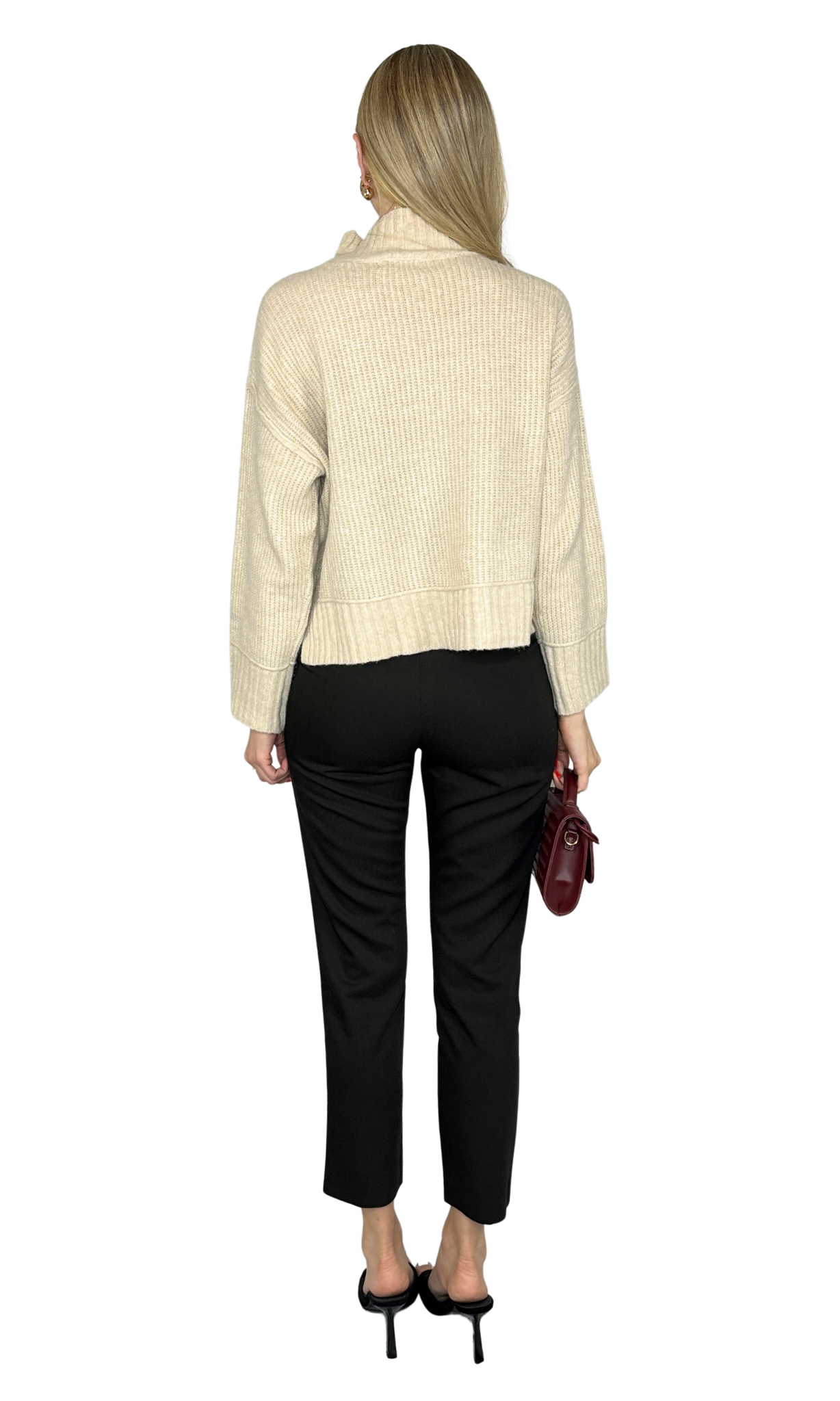Ellora Sweater in warm beige, featuring soft rib knit fabric, a mock neck, long sleeves with extended cuffs, drop shoulder design, and split hem. A refined and versatile piece perfect for layering or standalone wear.