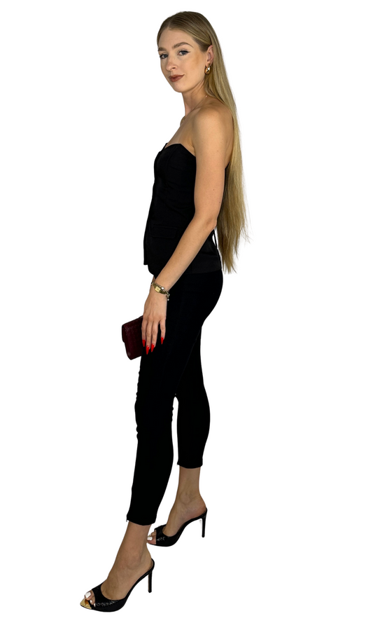 Gemma black fitted skinny pants featuring high-waisted pull-on style and front ankle zipper details for a sleek, polished look.
