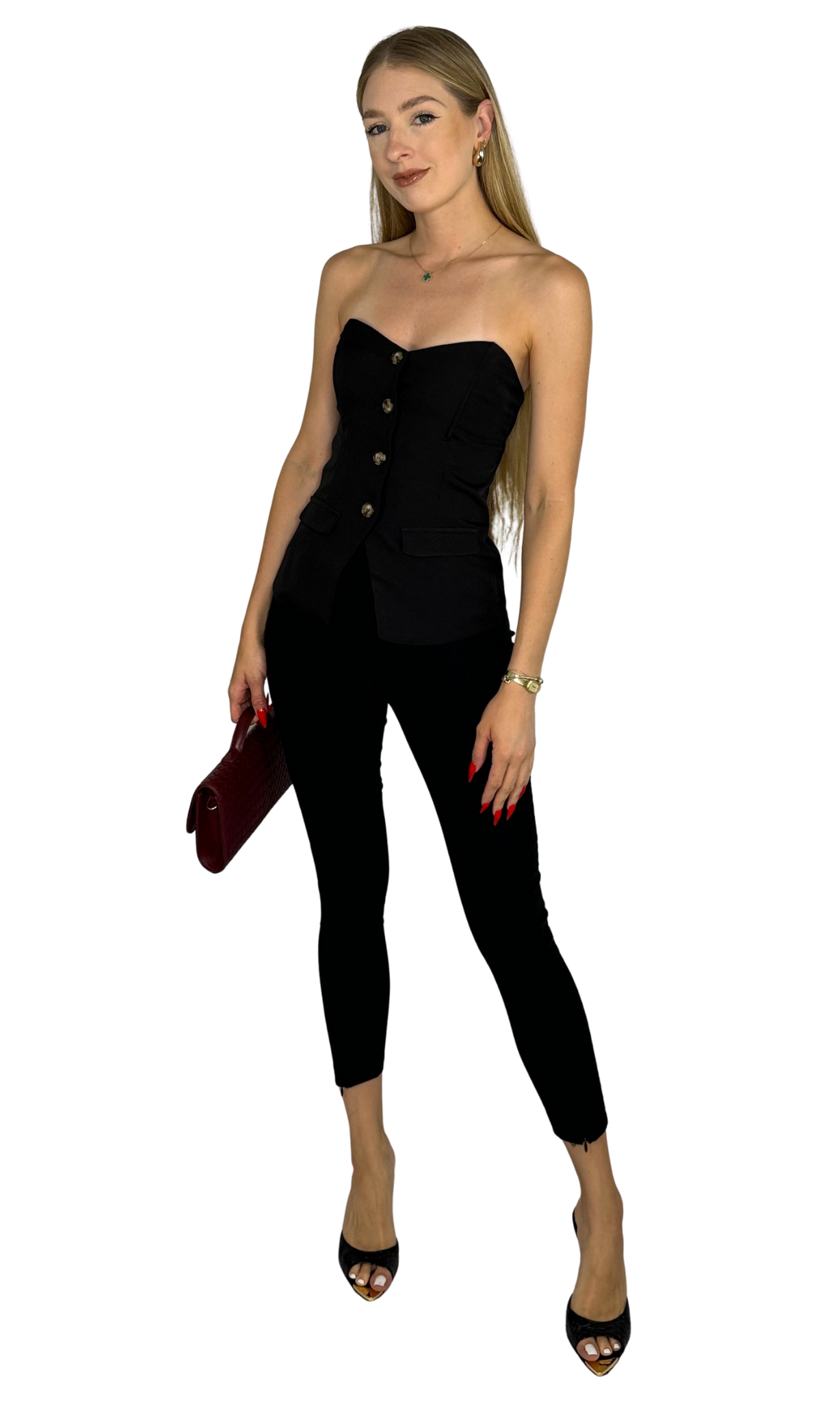 Gemma black fitted skinny pants featuring high-waisted pull-on style and front ankle zipper details for a sleek, polished look.