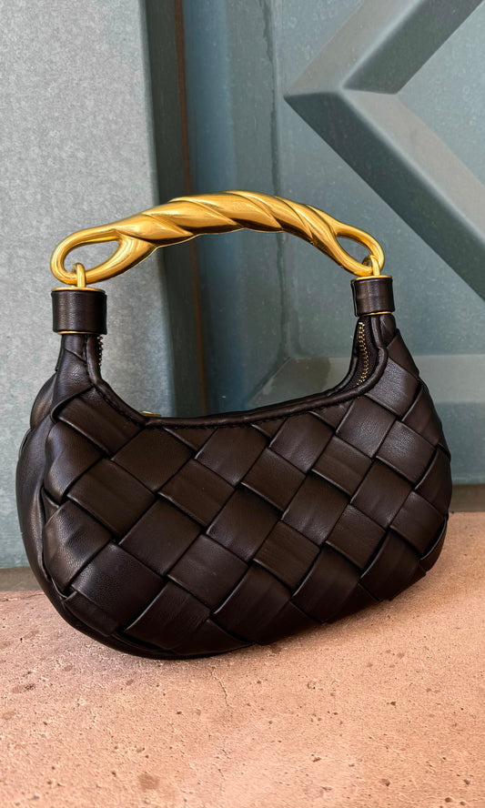 Black woven faux leather handbag with braided metal handle, bronze hardware, and removable crossbody strap