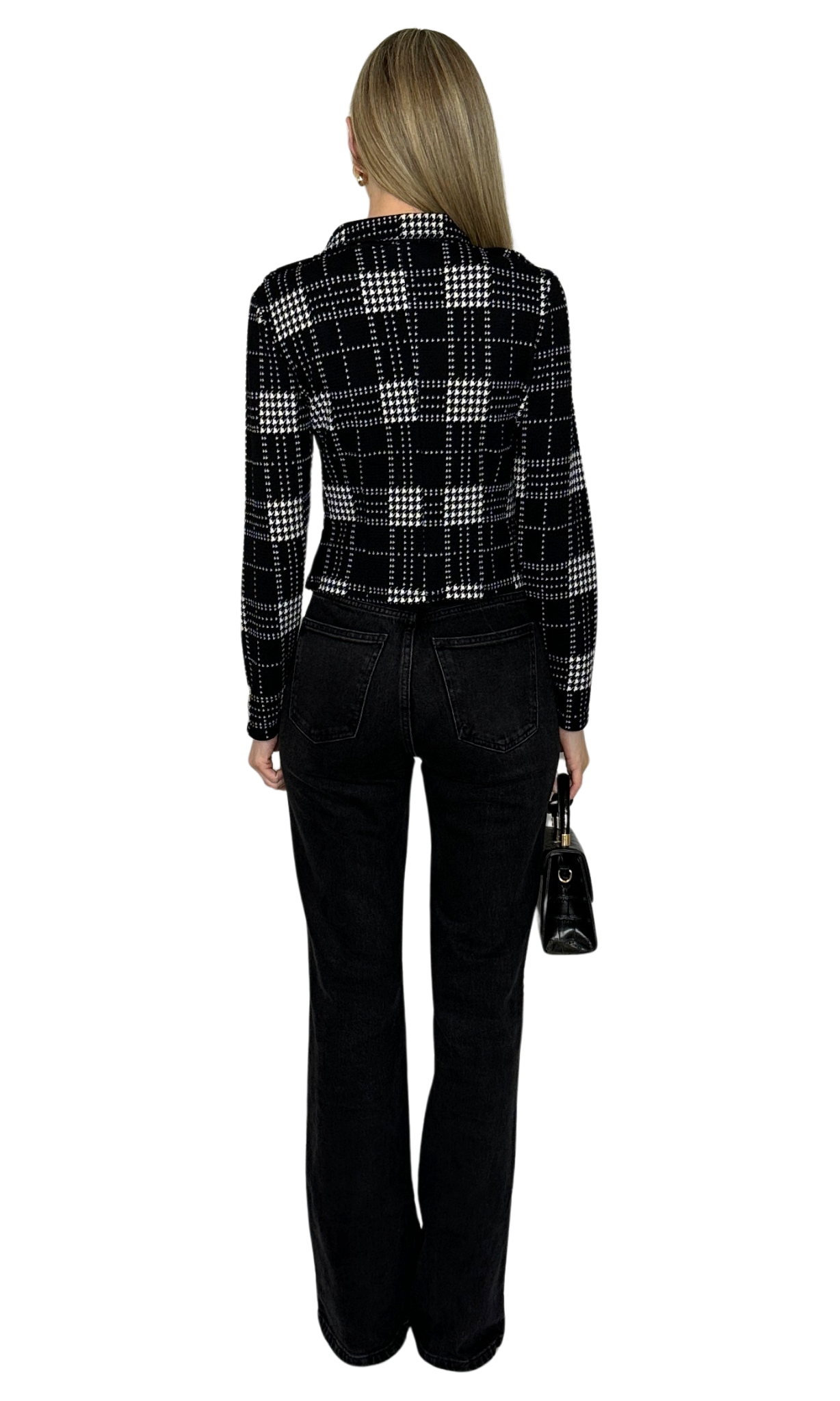Knit houndstooth print motorcycle jacket with decorative snaps, zipper accents, and a functional front zipper for a stylish day-to-night look.