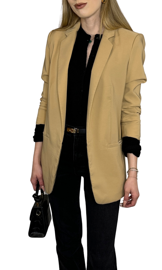 Taupe oversized tailored blazer with rolled sleeves and front pockets, designed for a versatile and stylish fit.