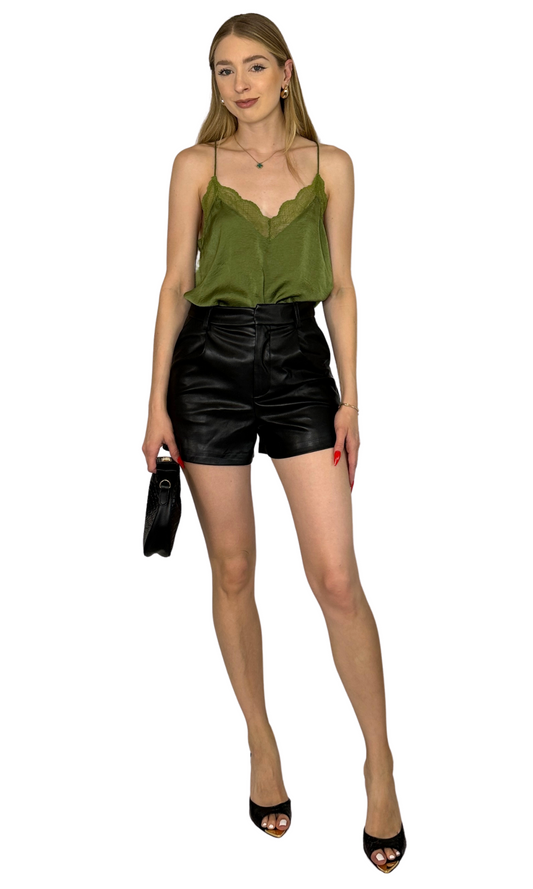 Spaghetti strap cami with lace details on the front and back, designed for comfortable and stylish day-to-night wear.