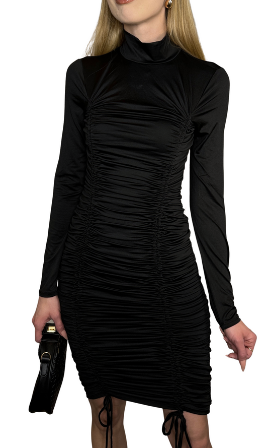 Long-sleeved black dress featuring a mock neckline, full ruching, and ties at the front hem, made from lightweight silky smooth fabric for a comfortable, flattering fit and effortless style.