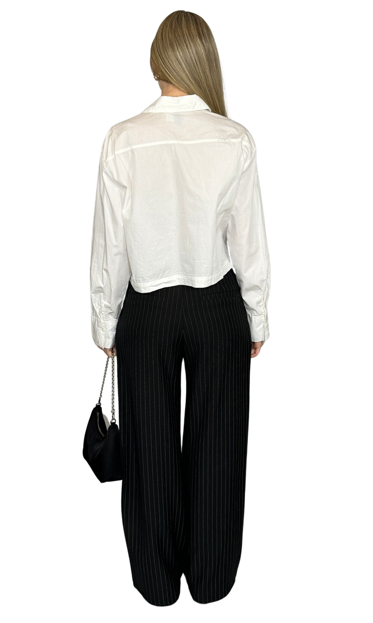 Women's black and white pinstriped trousers with elastic back, front pockets, and button closure – stylish and comfortable for professional wear