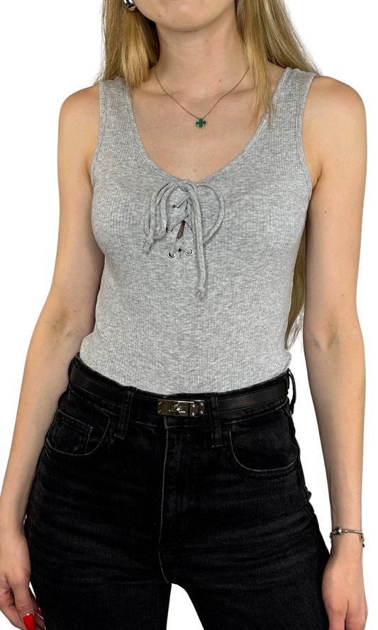 Super soft ribbed bodysuit featuring lace-up front detail and snap closure at the crotch, offering a comfortable and stylish fit perfect for any season.