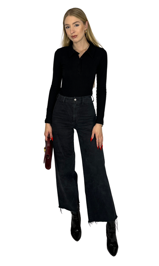 Sloan Bodysuit in black featuring a collared V-neckline, front button details, and long sleeves. Made from soft brushed fabric with a snap button closure for easy wear. A sleek, polished piece perfect for sophisticated, everyday looks.