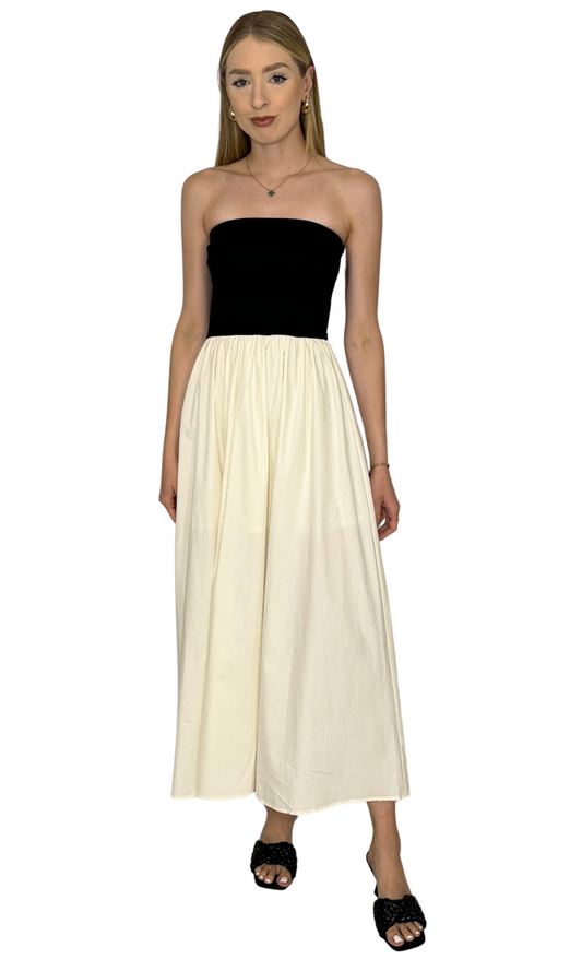 Women's strapless black and ivory midi dress with flowy skirt, minimalist two-tone design – ideal for summer or vacation outfits