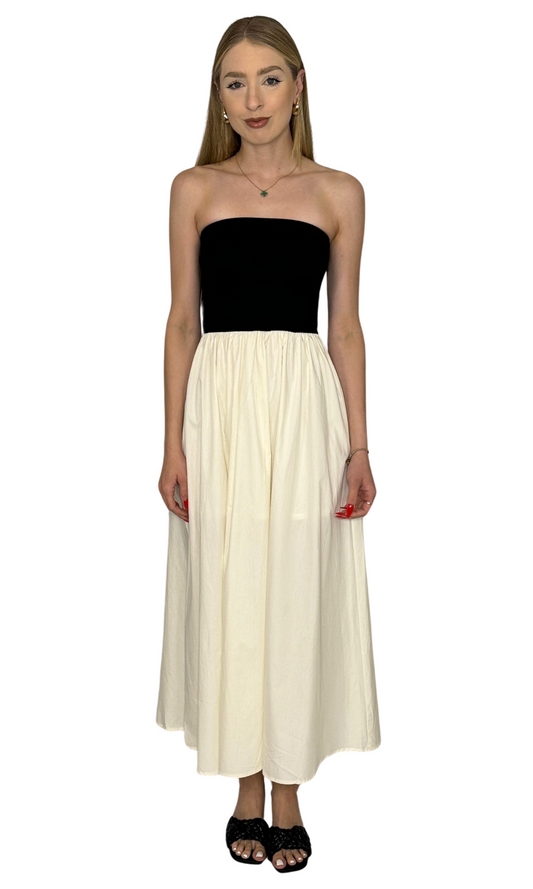 Women's strapless black and ivory midi dress with flowy skirt, minimalist two-tone design – ideal for summer or vacation outfits