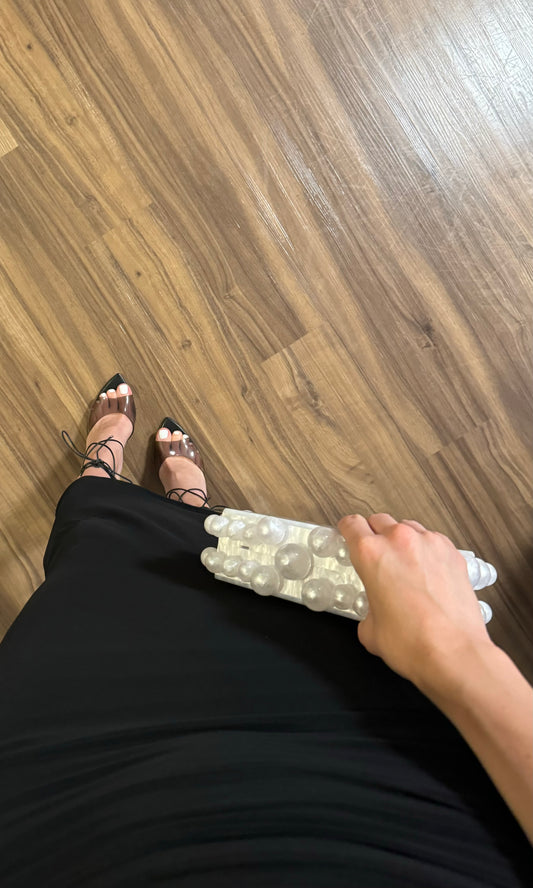 White acrylic beaded clutch bag with hard case design for elegant evening or casual looks.