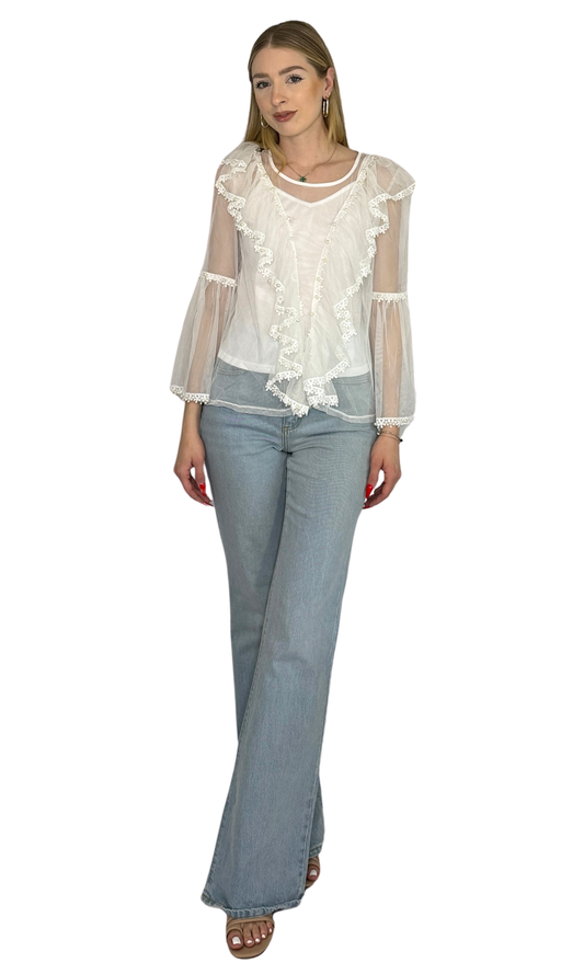 White embroidered top featuring pearl accents on the sleeves and body, paired with a white shell for added coverage and breathable all-day comfort.