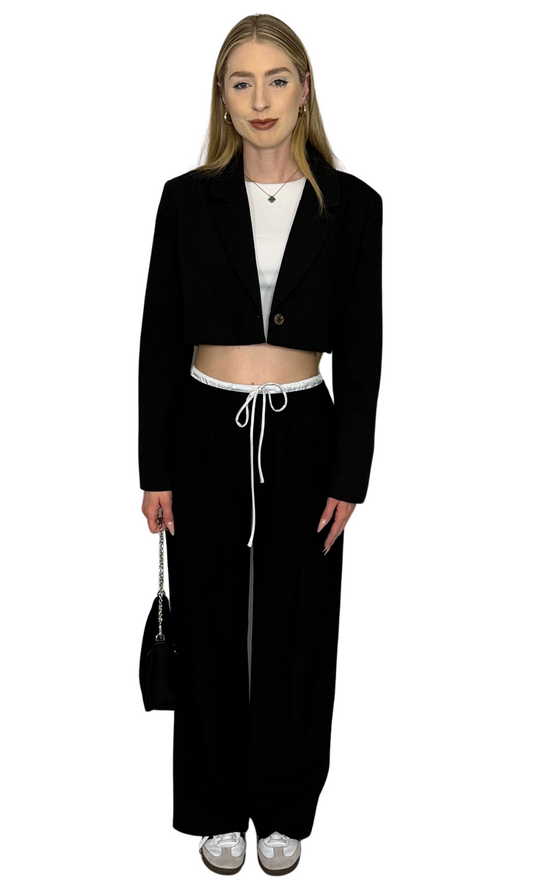 White seamless knit crop top featuring short sleeves and double-lined construction for breathable comfort and versatile style.