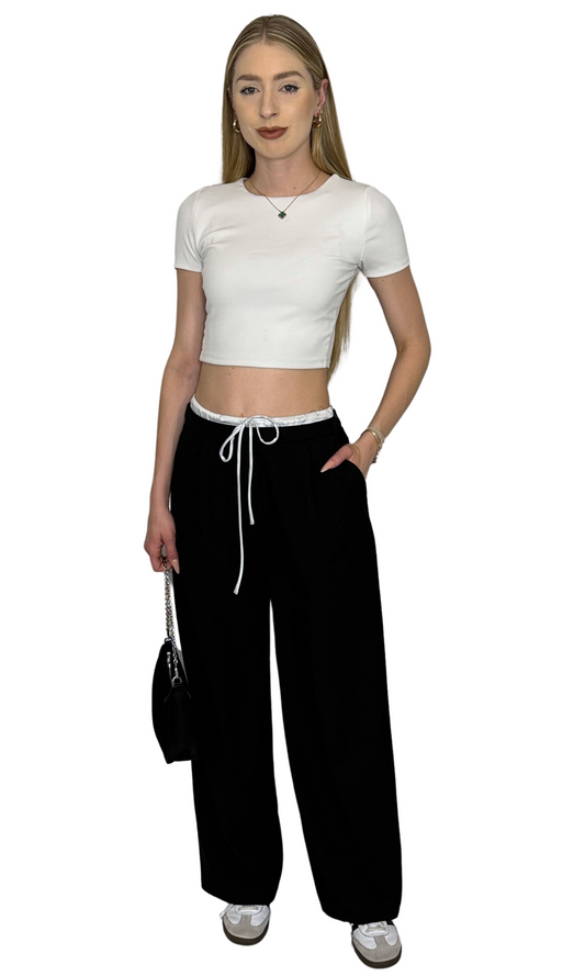 White seamless knit crop top featuring short sleeves and double-lined construction for breathable comfort and versatile style.