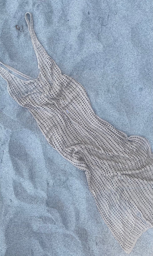 Beige crocheted knit maxi dress cover-up with criss cross back, tie waist belt, and side slits — perfect for beach or poolside glamour.