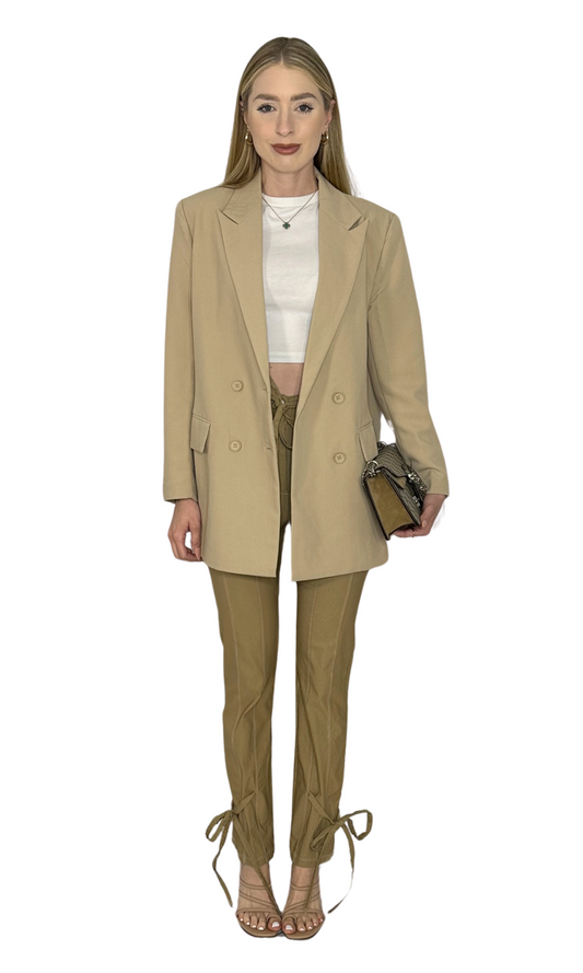 Khaki high-waisted tie pants with a removable belt, white contrast stitching, and tie accents at the ankles.