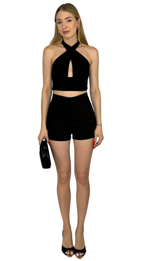 Black criss cross halter top with adjustable hook and eye closures along the straps for a snug and stylish fit.