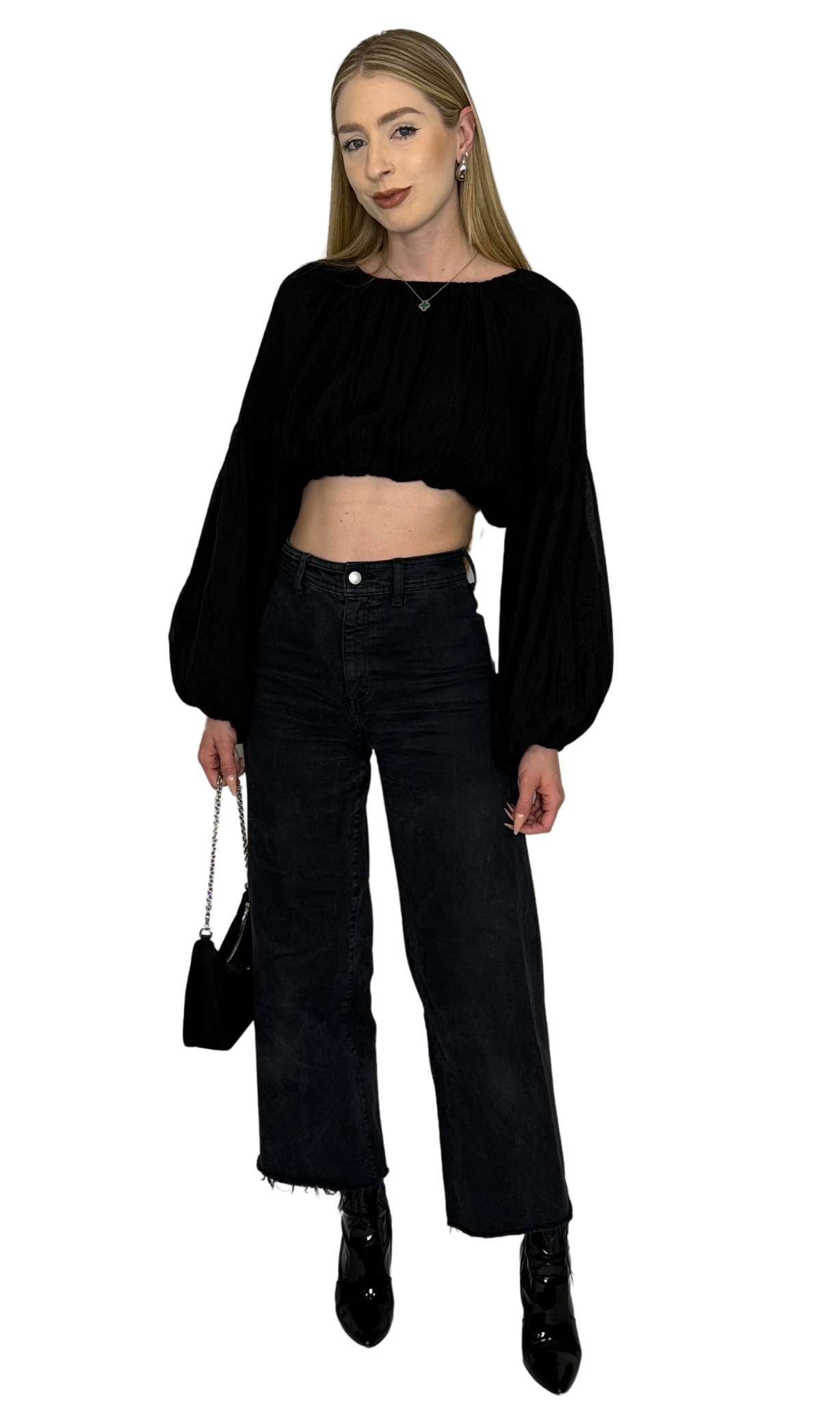 Black crop top featuring long puff sleeves with elastic at the bottom for a balloon effect, made from soft, comfortable fabric ideal for day-to-day wear with stylish sleeve shaping.