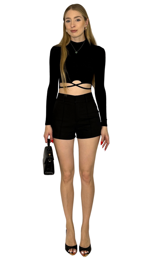 Black long sleeve top with a mock neckline and criss cross string detail on the front, combining comfort with a bold, statement-making design.