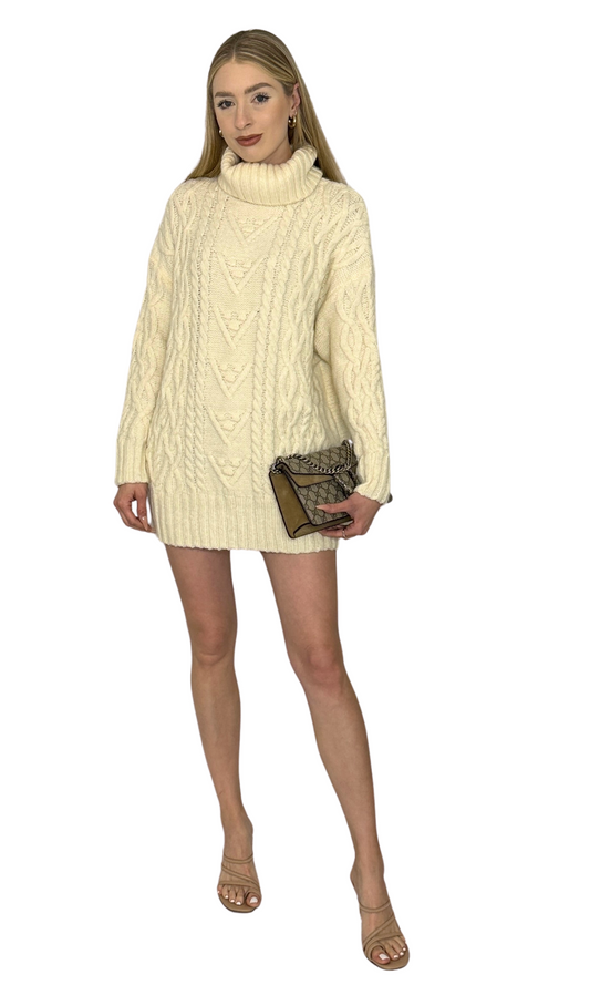 Cream thick turtleneck knit sweater dress with a classic silhouette, designed to flatter any body type and perfect for dressing up or down.