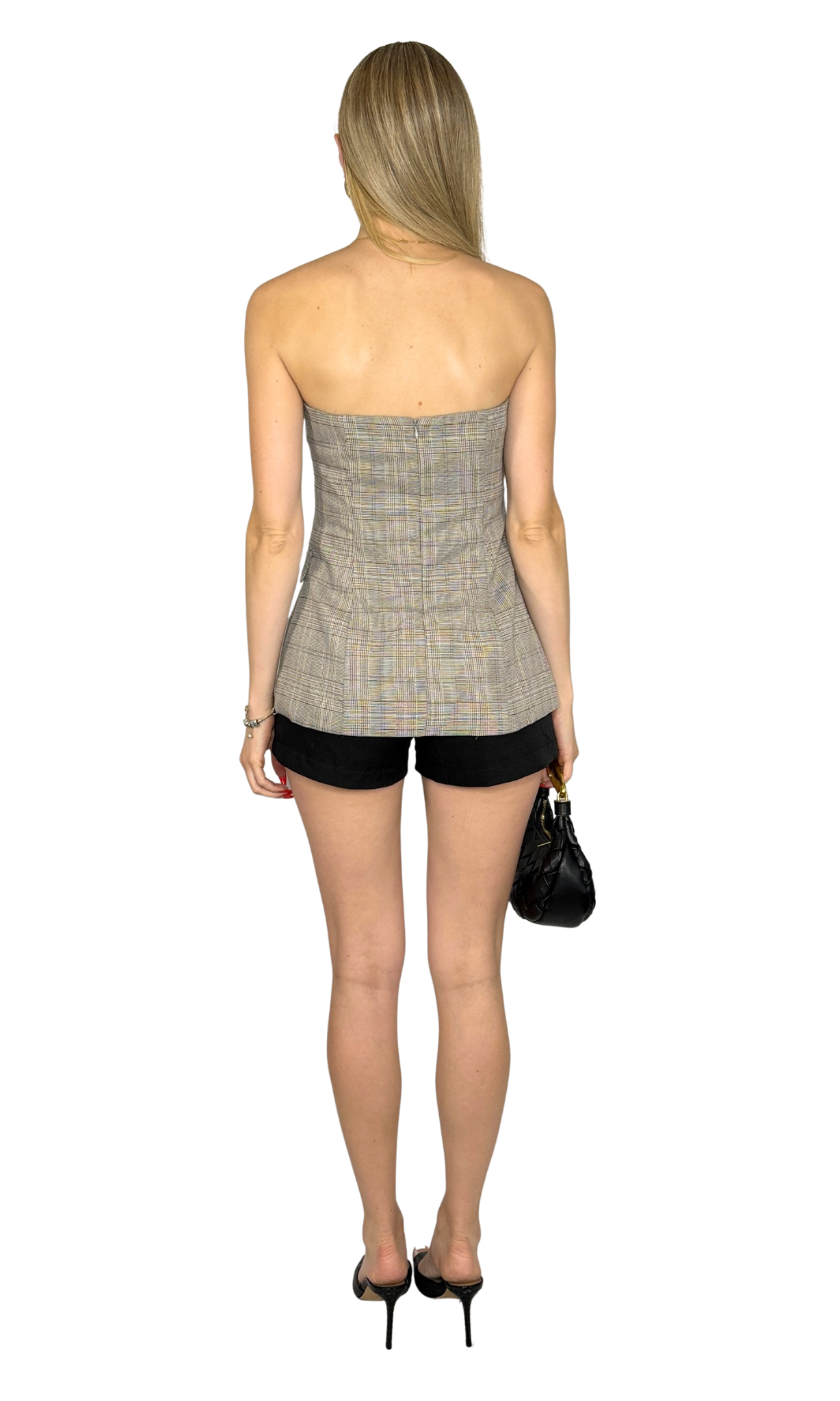 Emmi Plaid Top featuring a strapless design, button-down detail, split front hem, and back zipper. A fully lined plaid corset-style top that combines classic patterning with modern sophistication.