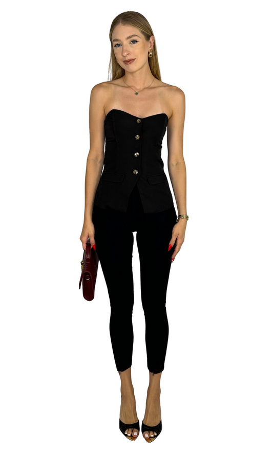 Gemma black fitted skinny pants featuring high-waisted pull-on style and front ankle zipper details for a sleek, polished look.