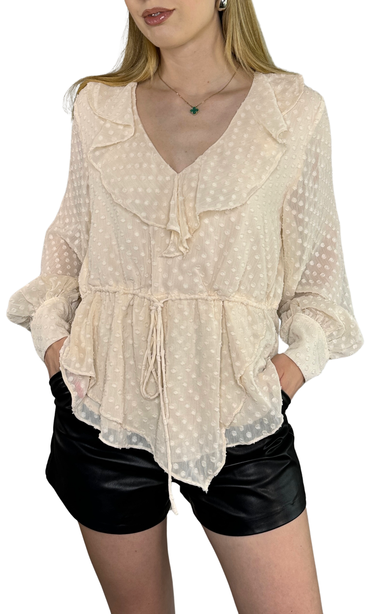 Ivory asymmetrical top featuring an adjustable drawstring waist tie and button tabbed cuffs, designed for a sophisticated look from day to night.