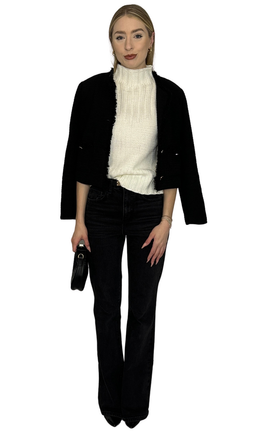 Ivory sleeveless sweater top featuring a sophisticated high neckline, designed for a refined and elegant look — the Cindy Sweater, perfect for elevating any outfit.