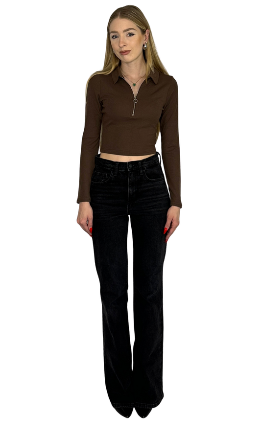 Long sleeve crop top made from soft, ribbed fabric featuring a front zipper for adjustable fit and added convenience.