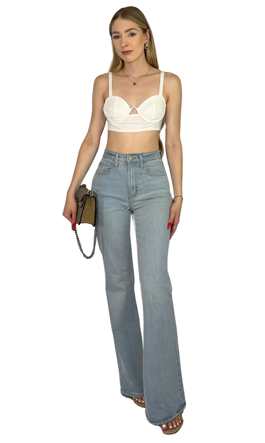 White ribbed knit bra top with adjustable straps, underwire structure, and cut-out detail for comfort and feminine style.